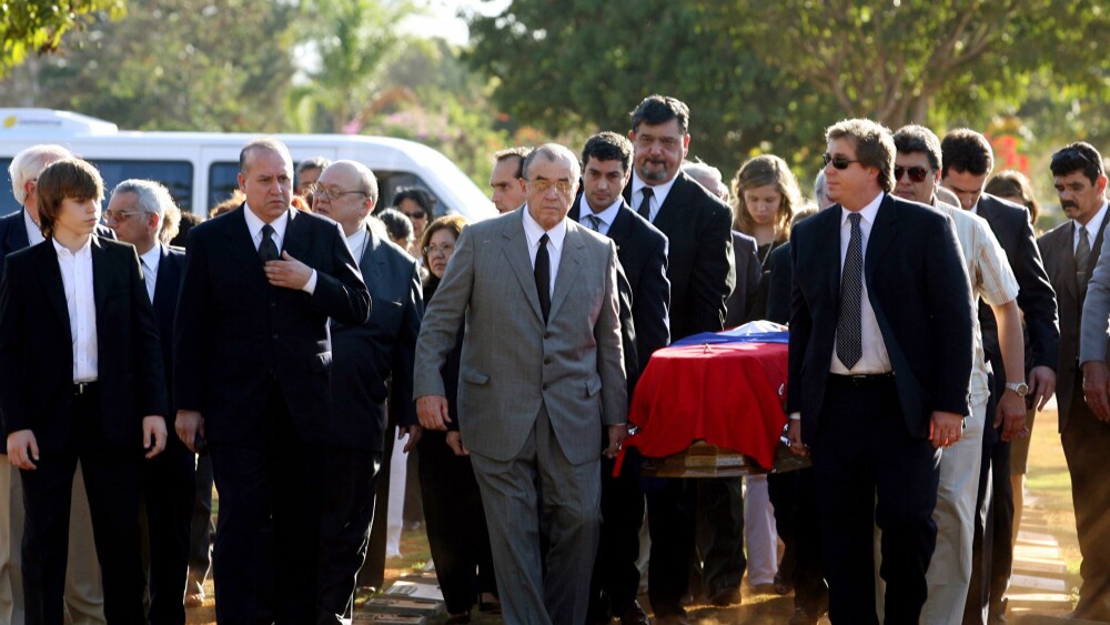 Gustavo Stroessner, son of former Paraguayan dictator Alfredo Stroessner, leads relatives and friends as they carry his father's coffin to be buried in a cemetery in Brasilia