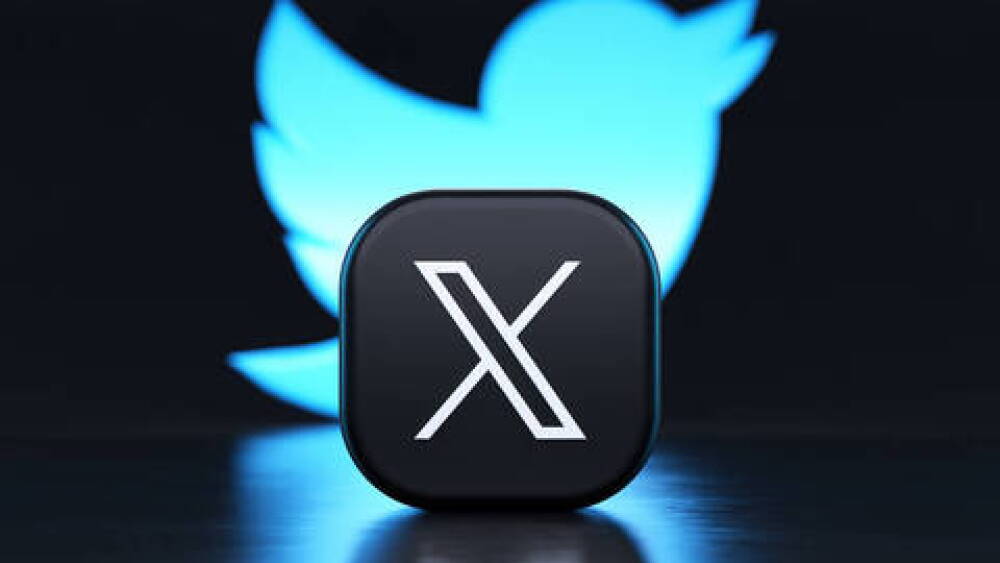 Valencia, Spain - July, 2023: X app logo in front of the Twitter blue bird symbol background in 3D rendering. X is the new name and logo of the social network Twitter owned by Elon Musk