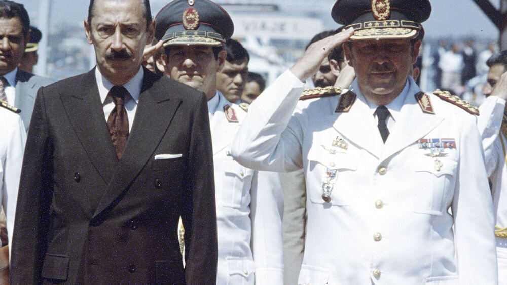 File photo of Argentine Army General Jorge Videla, with Paraguayan dictator Alfredo Stroessner in Asuncion